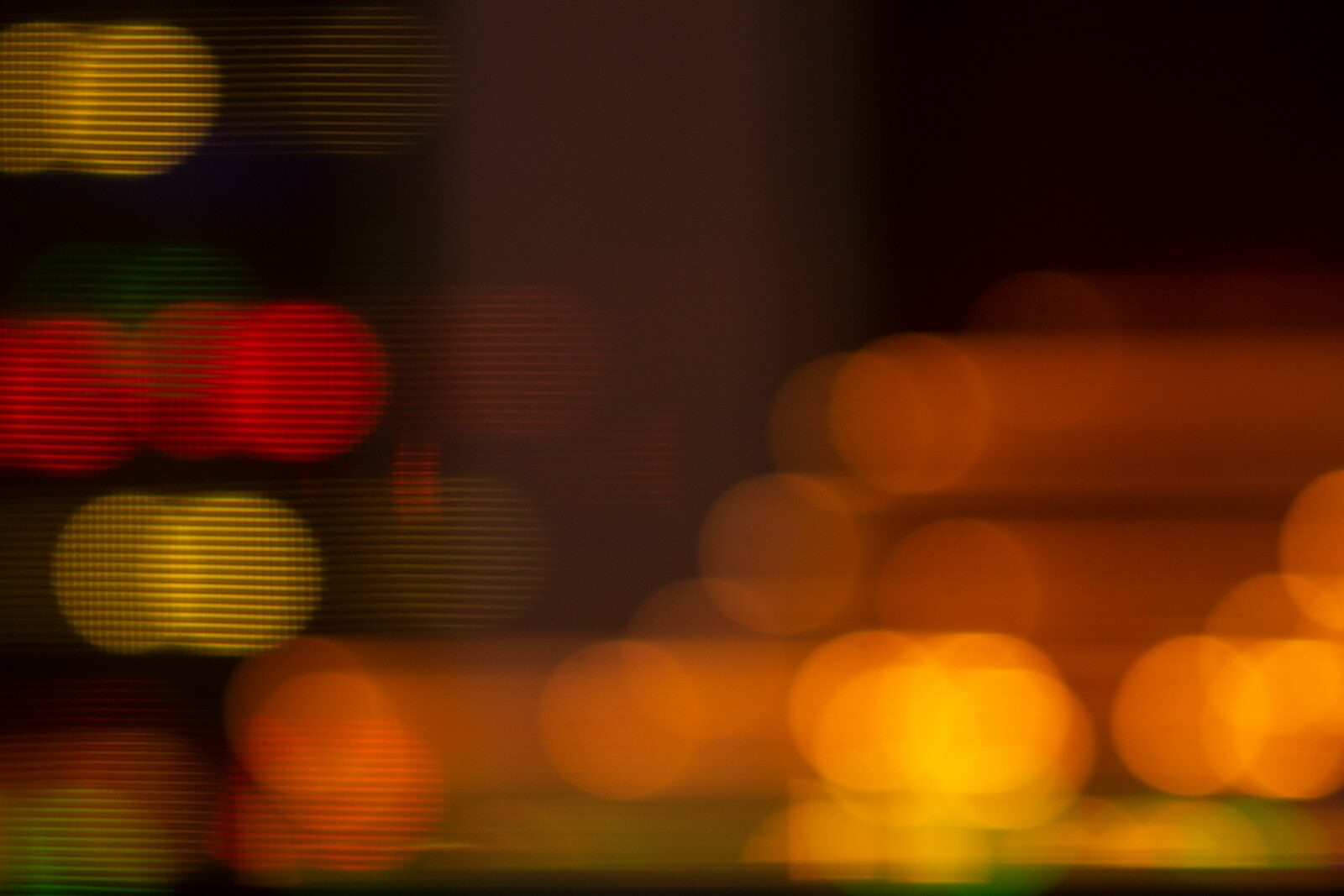 a blurry photo of a city street at night